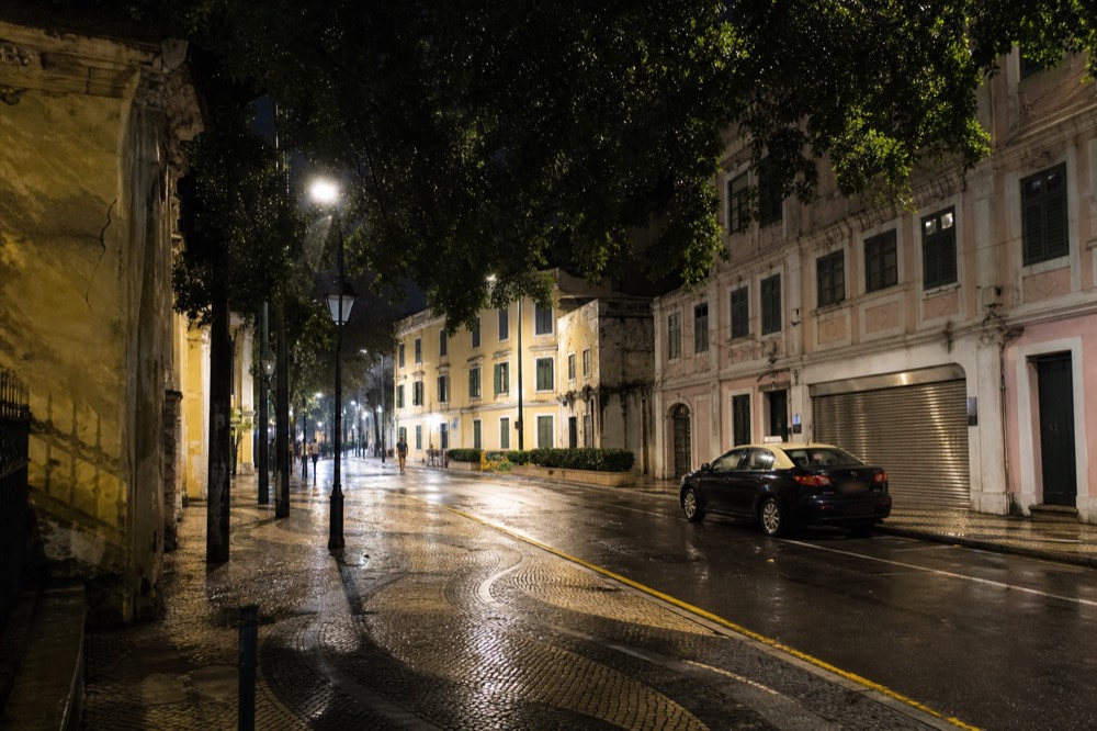Quiet lit street corner in the Macau peninsula historic quarter at night