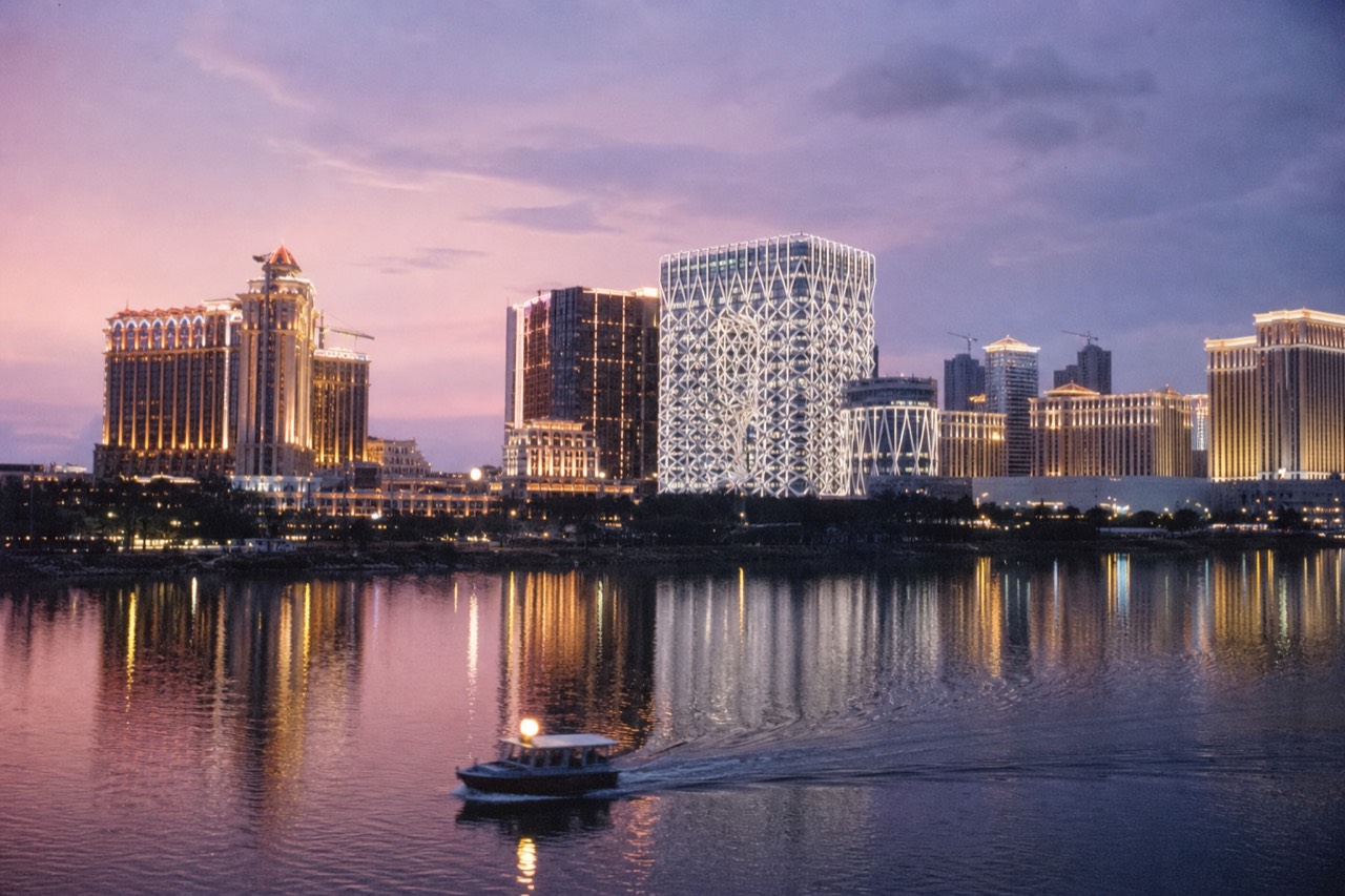 Cotai resort skyline at dusk seen across the water