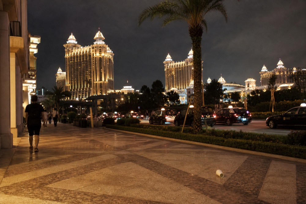 A Cotai resort exterior at night with illuminated towers
