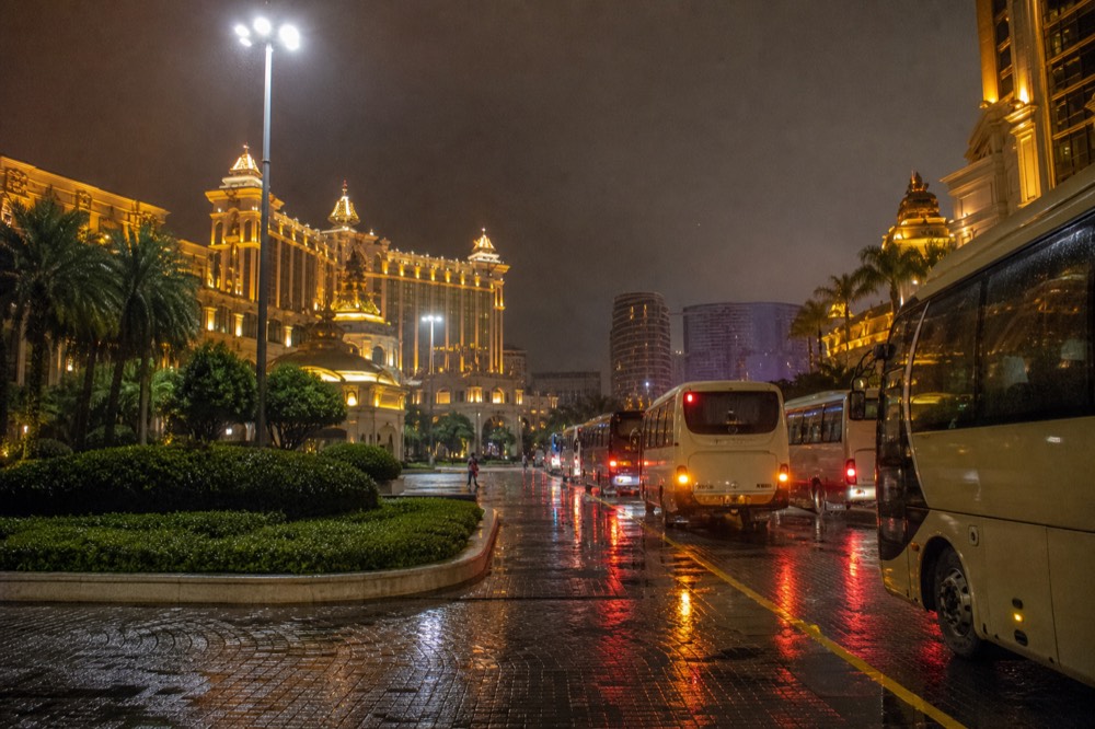 Evening lights of Cotai resort towers in Macau seen from street level