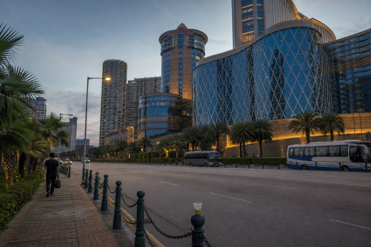 The illuminated exterior of the City of Dreams resort complex in Cotai Macau at dusk