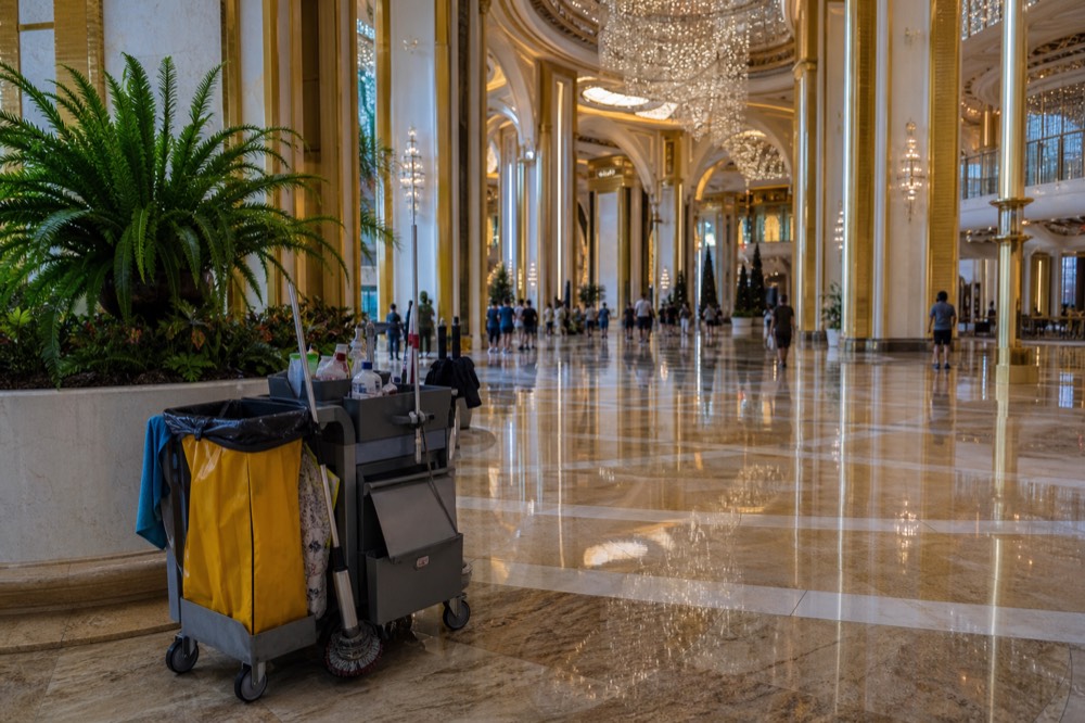 Grand resort lobby interior with chandeliers and marble floors