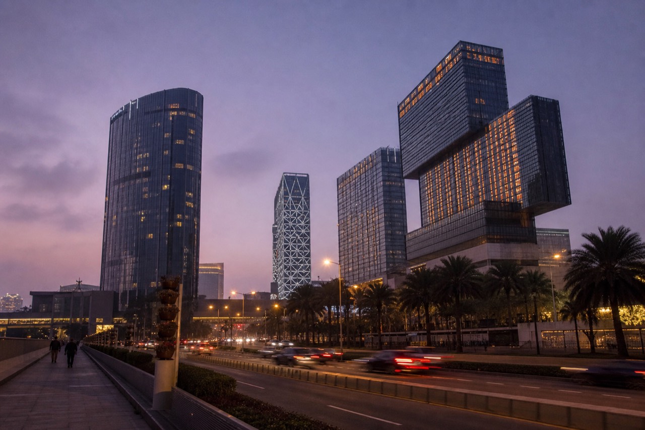 Colourful Macau cityscape at dusk with resort towers lit