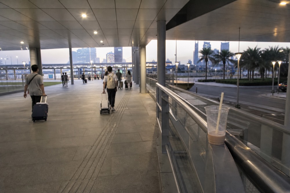 Ferry terminal concourse with departure boards in the evening