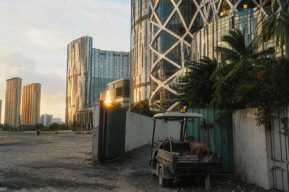 Cotai resort towers rising above reclaimed flat land at golden hour