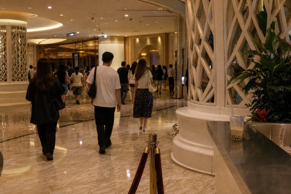 The theatre foyer filling with audience members before doors open