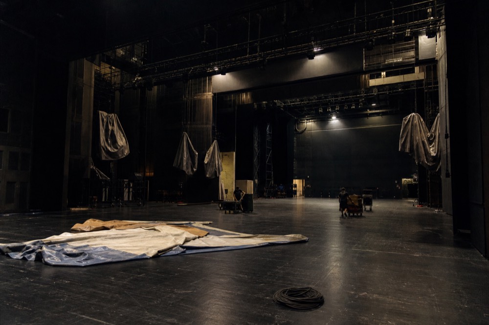 An empty theatre stage with house lights up in Macau
