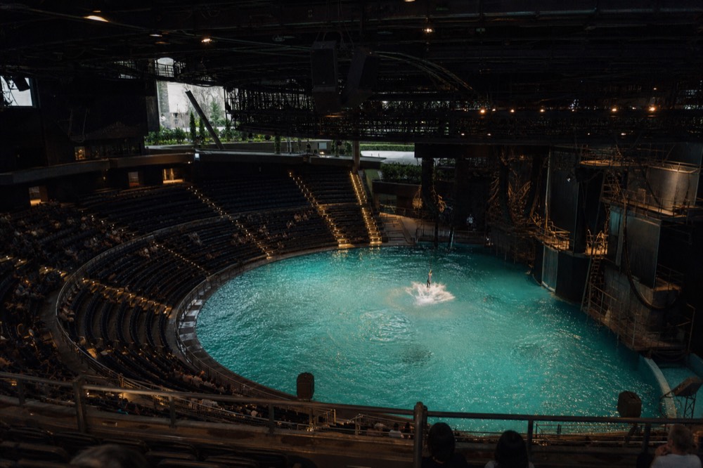 The Dancing Water Theatre auditorium in the round with the pool stage lit below