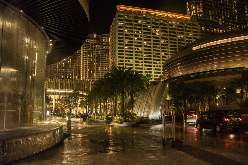 City of Dreams resort towers glowing over Cotai at night