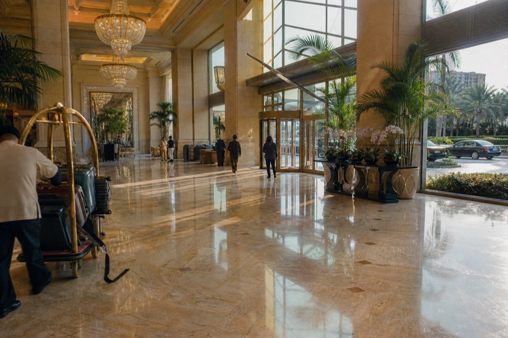 Hotel lobby with grand chandeliers and marble floors in a Cotai resort